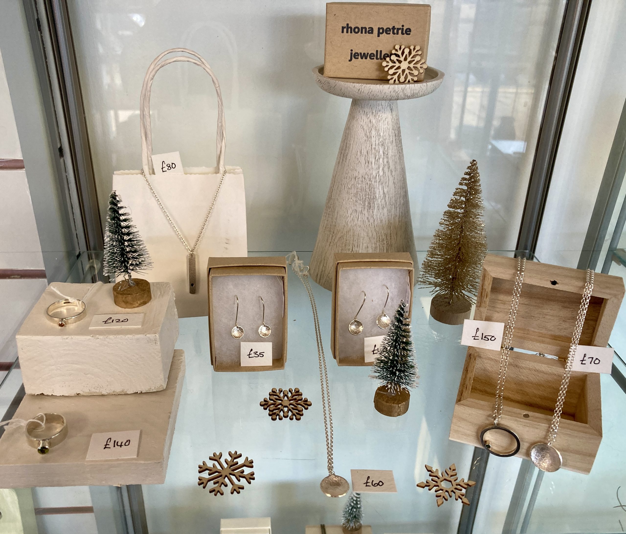 Christmas display of silver earrings and necklaces