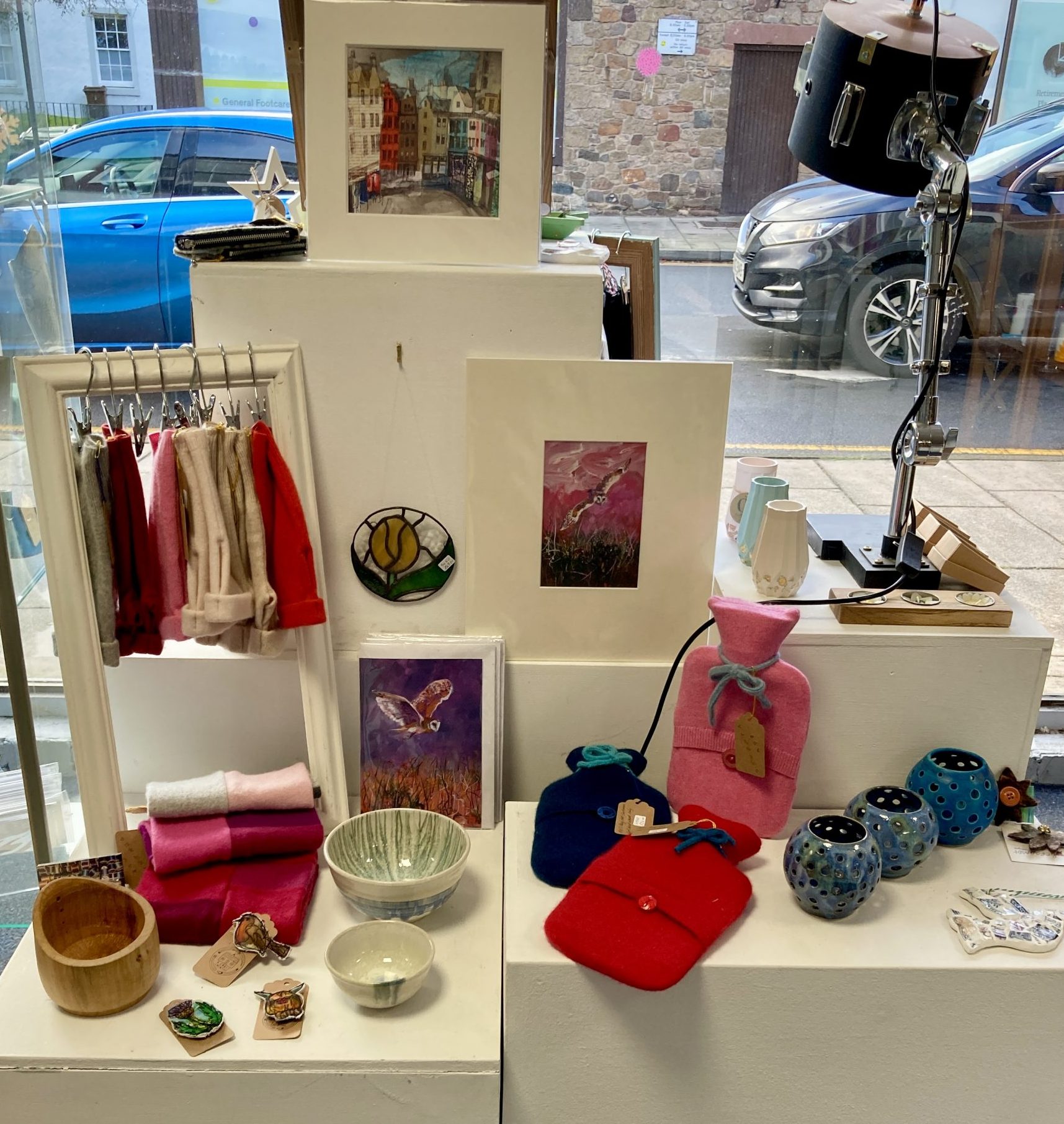 Display of print, ceramics and upcycled cashmere: gifting